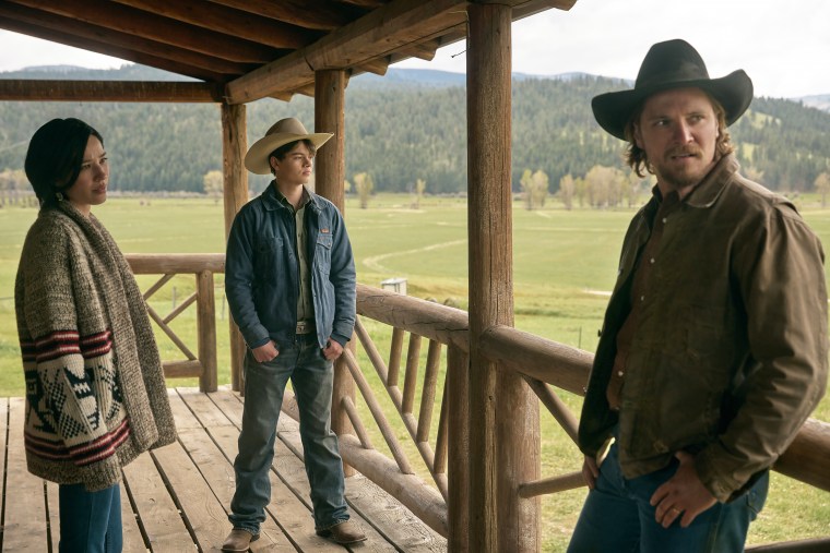 Kelsey Asbille as Monica Long, Brecken Merrill as Tate Dutton and Luke Grimes as Kacey Dutton in "Yellowstone."