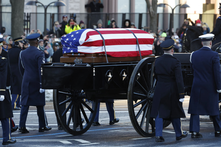 A horse-drawn caisson carries former President Jimmy Carter's flag-draped casket to the Capitol on January 7, 2025.