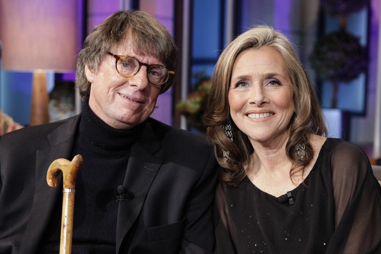 Richard Cohen and Meredith Vieira smile while seated next to each other