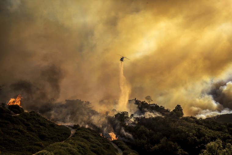 Water is dropped on the advancing Palisades Fire 