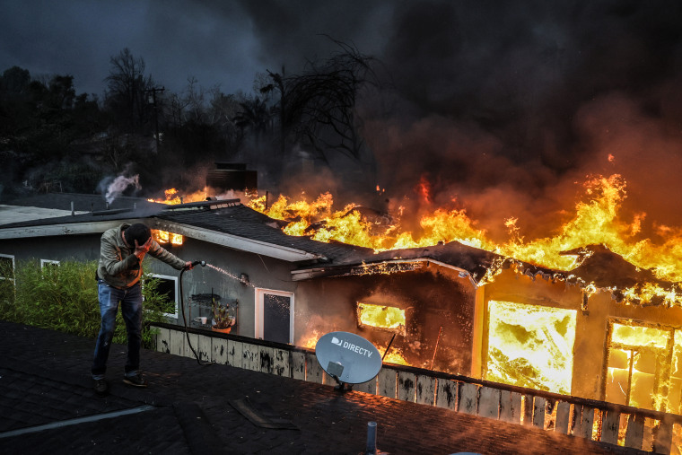 Eaton fire burns homes in Altadena.