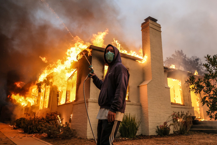 Eaton fire burns homes in Altadena.