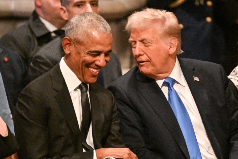 Barack Obama laughs with Donald Trump