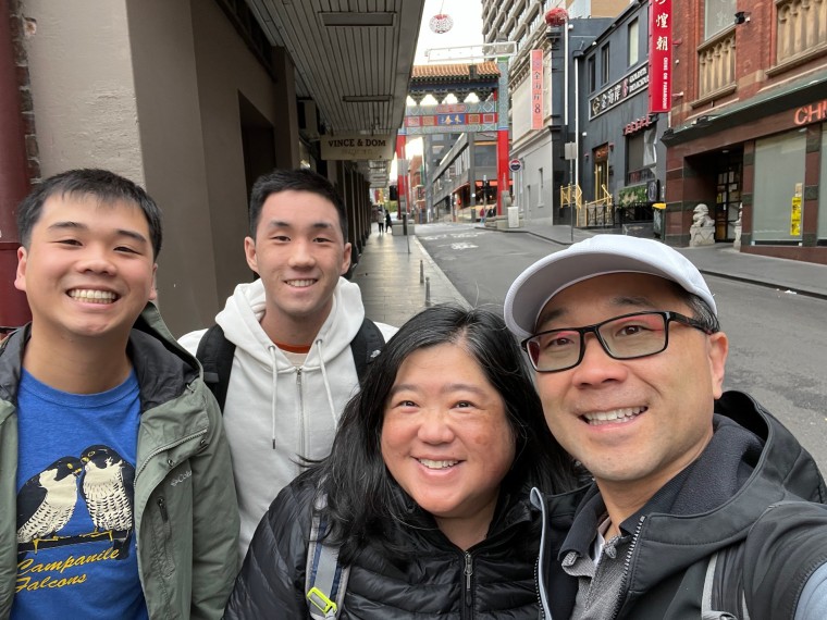 Sharon Wong and her three family members stand together for a group portrait