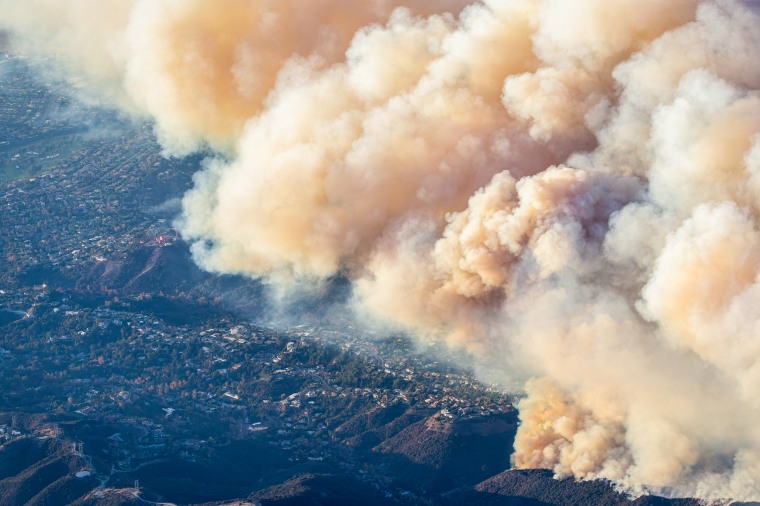 Helicopter aerial view  of the Palisades fire burning near Mountain Gate Country 
Club.