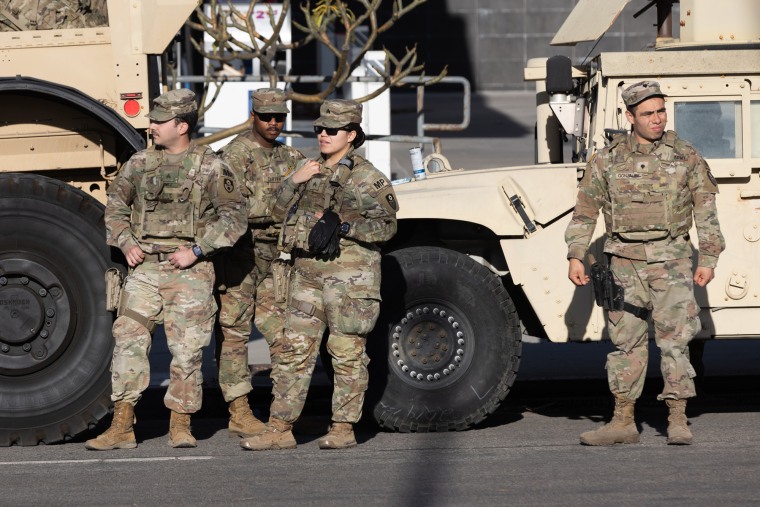 National Guard troops stand outside