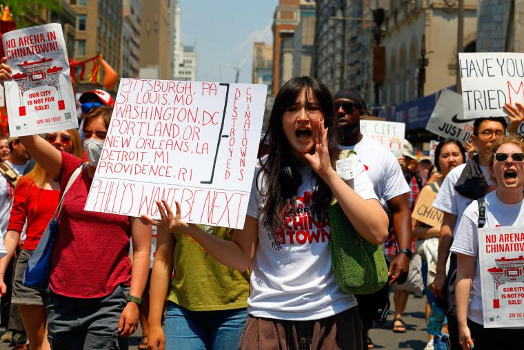 Marchers protest a proposal to build an arena near Philadelphia's Chinatown 