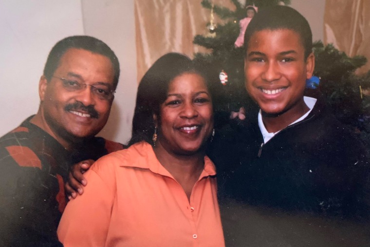 From left, Darrell Carr, Susan Carr, and Justin Carr pose together for a portrait