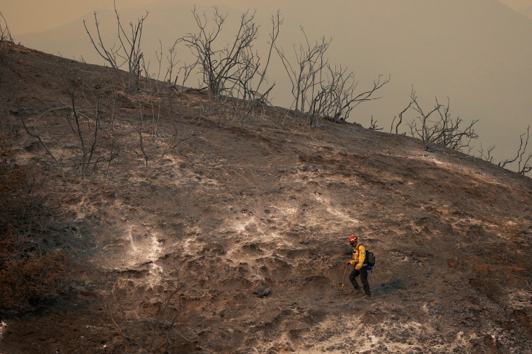 Image: Powerful Winds Fuel Multiple Fires Across Los Angeles Area firefighter hillside palisades fire