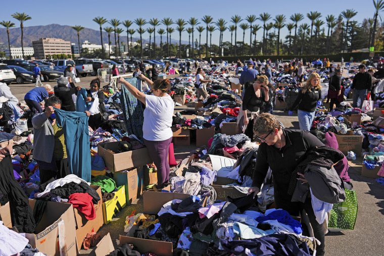 Items are laid out at an aid center for people affected by wildfires at Santa Anita Park Monday, Jan. 13, 2025, in Arcadia, Calif.