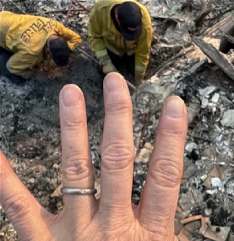 Victoria Desantis shows off wedding band after it was discovered by firefighters in the ashes.