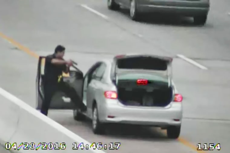 Roberto Felix Jr., points his gun into Ashtian Barnes' car after shooting him during a traffic stop.