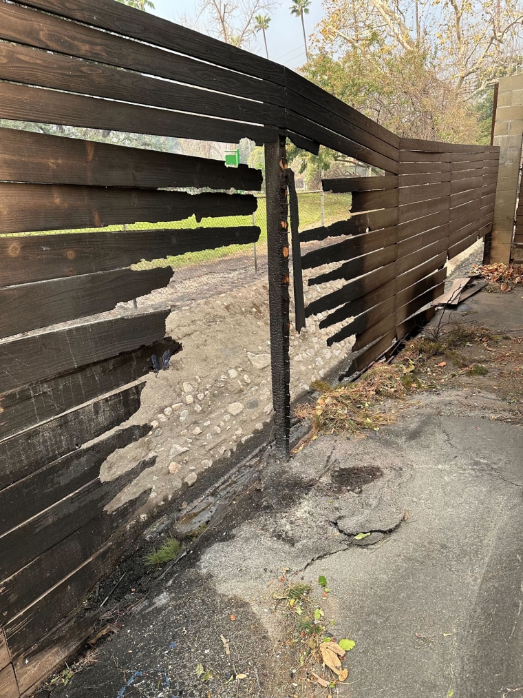 A damaged wooden fence