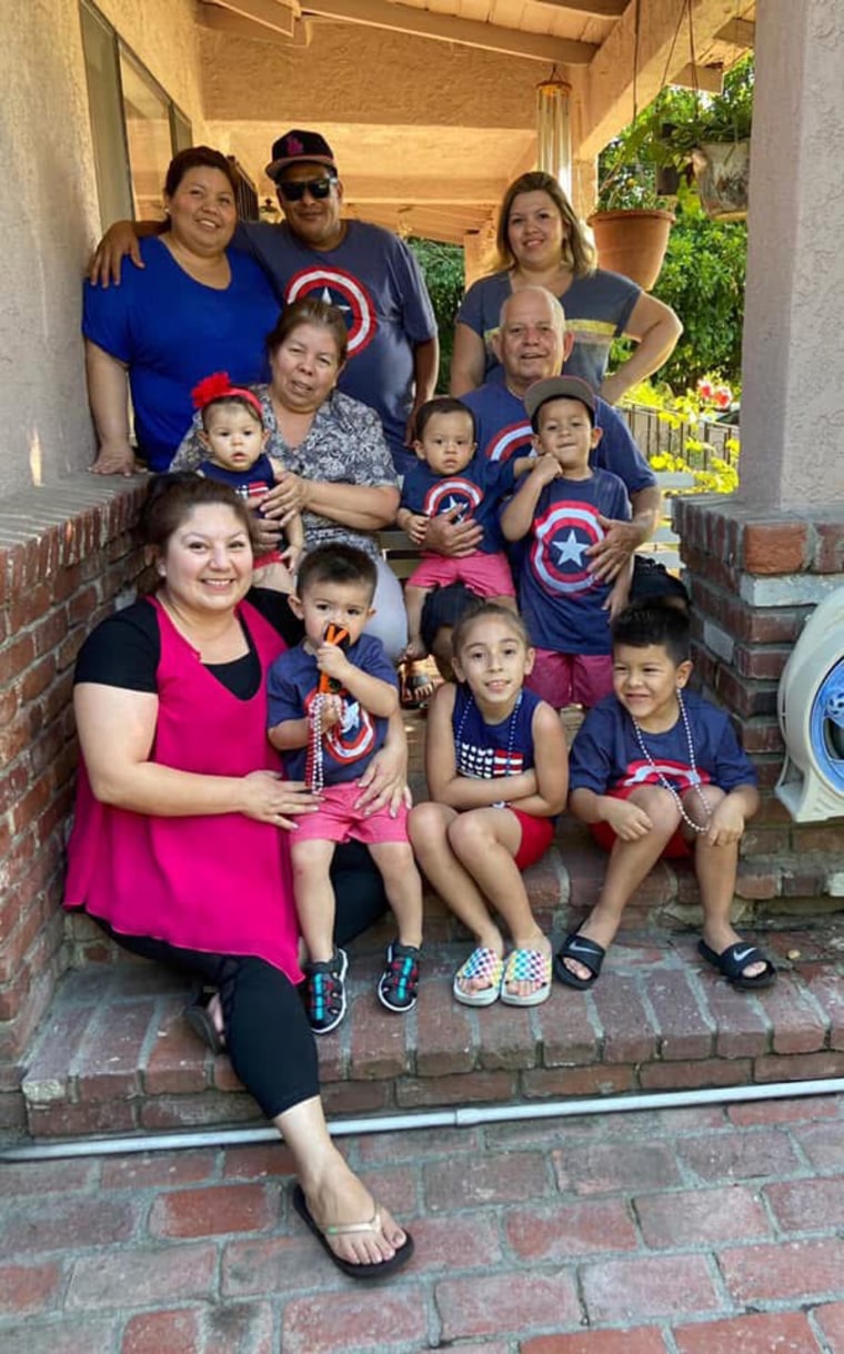 The Carillo/Hernandez family sit on the porch of their Altadena home, where they also ran a licensed day care.