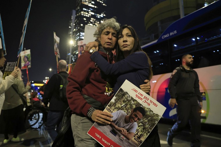 People react to the reports of a possible Gaza cease fire and hostage release on Jan. 15, 2025 in Tel Aviv.