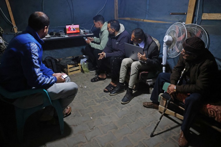 Gazans gather to watch news of a ceasefire agreement