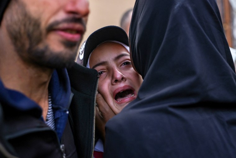 A Palestinians woman reacts to the death of a loved one killed an Israeli strike the previous night, outside Nasser Hospital in Khan Yunis, southern Gaza, on Jan. 16, 2025.