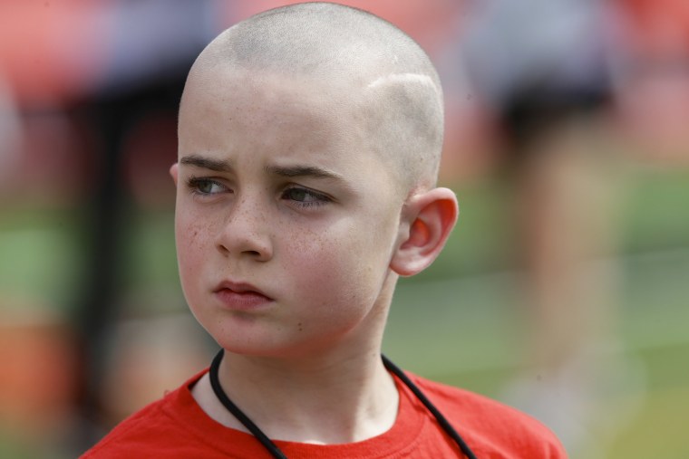 Jack Hoffman before delivering a drug-free pledge during the halftime of a Nebraska college football game in 2014.