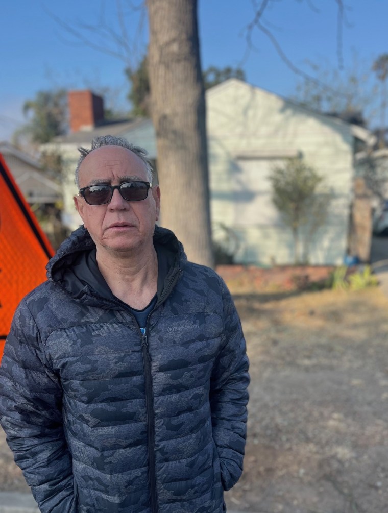 Image: Antonio Antonetti stands outside his home in Altadena, Calif., which he saved from the Eaton Fire, on Jan. 18, 2025.