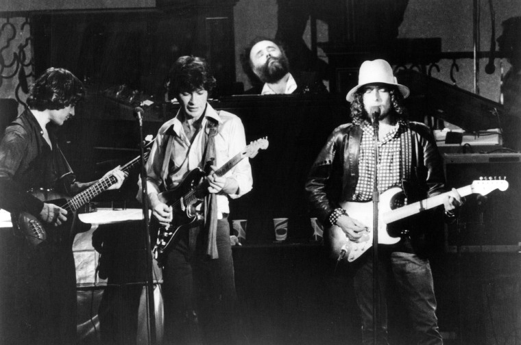 From left, Rick Danko, Robbie Robertson and Garth Hudson of The Band perfor with Bob Dylan at their farewell concert, released on film as "The Last Waltz," in 1976.