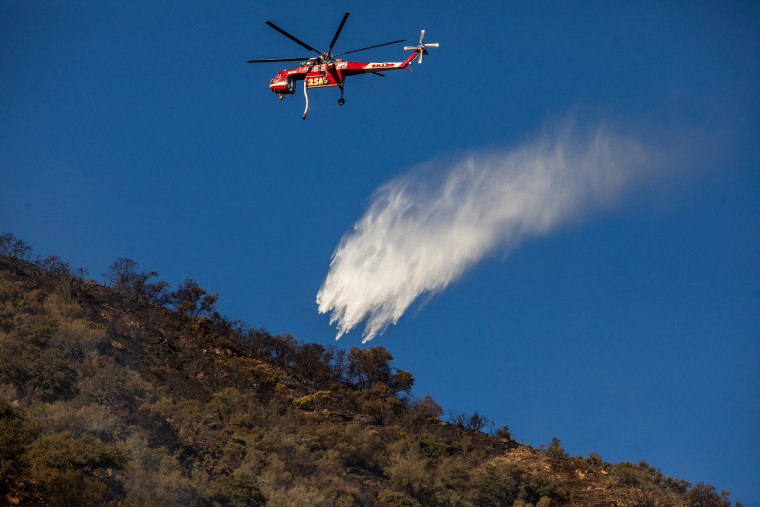 Image: hughes fire water drop firefighting helicopter