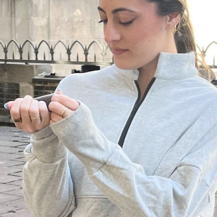 Murphy, fixing her sleeves.