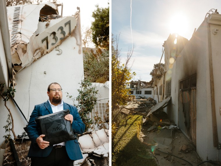 Sholom holds religious items he took when he evacuated