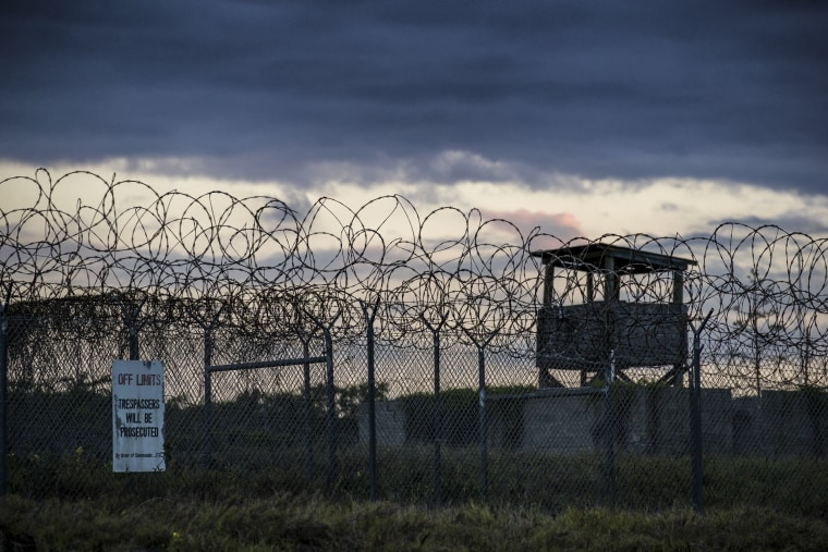 The sun sets behind the closed Camp X-Ray detention facility, on April 17, 2019, in Guantanamo Bay Naval Base, Cuba. 