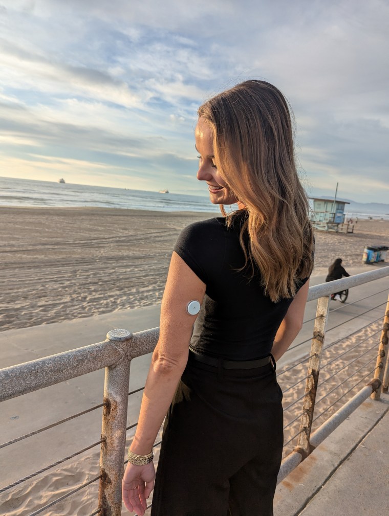 Shannon Sackley wearing a continuous glucose monitor.