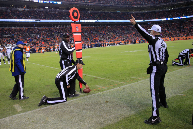 A NFL referee signals a first down call in 2014.