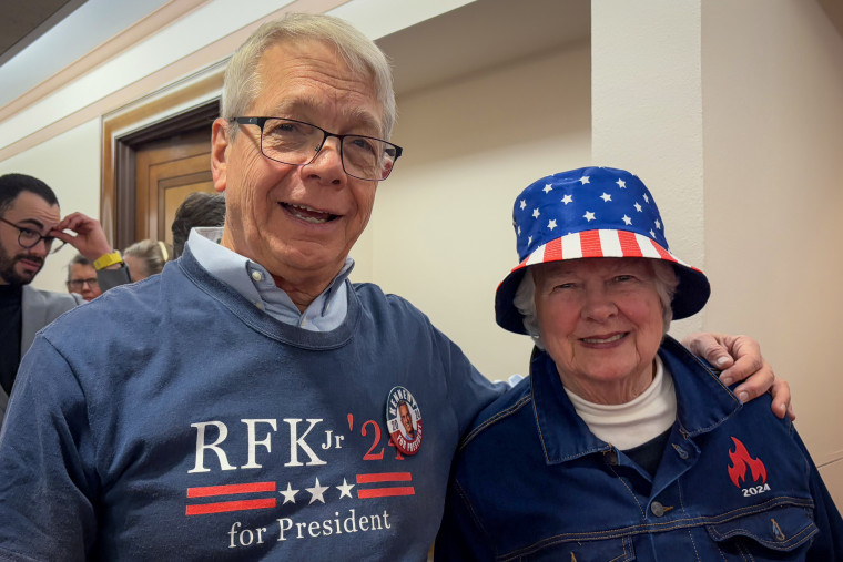 RFK Jr. supporters wait in long lines outside the hearing rooms.