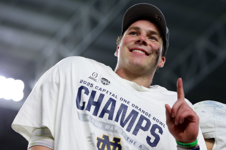 Notre Dame Fighting Irish quarterback Riley Leonard poses after defeating the Penn State Nittany Lions 27-24 in the Orange Bowl.