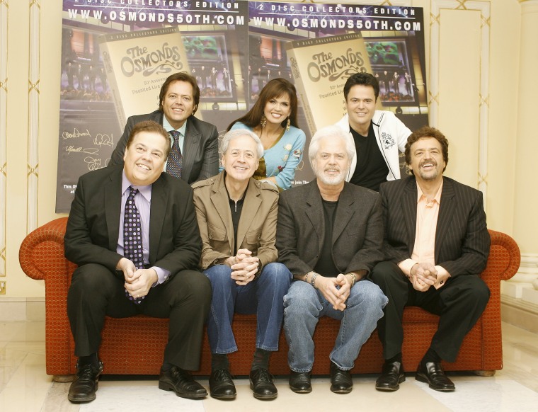 The family promoting The Osmonds 50th Anniversary Reunion DVD. Alan, Jimmy, Wayne, Marie, Merrill, Donny and Jay Osmond.