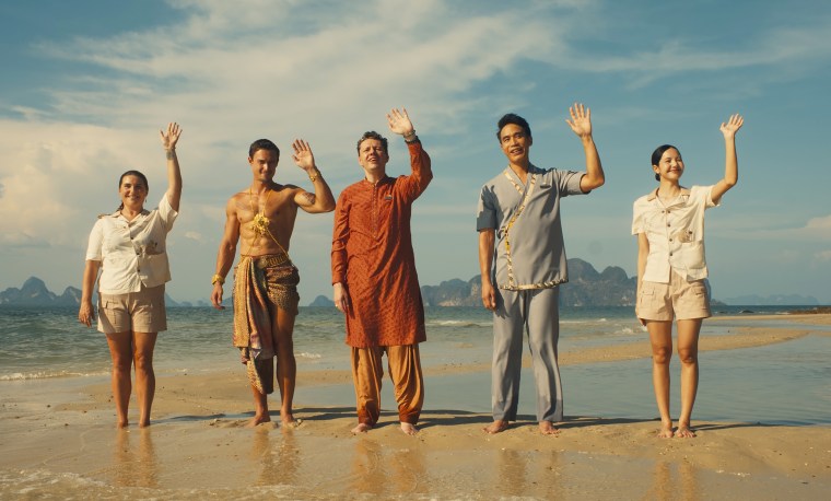 Resort staff of "The White Lotus" wave to their new guests.