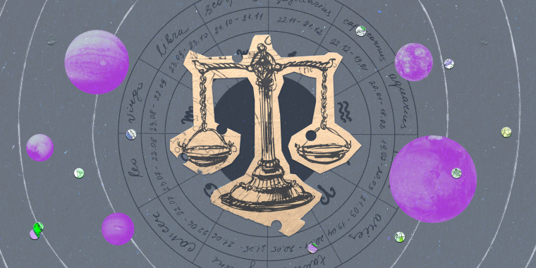 Paper cutout of the libra zodiac on a gray background