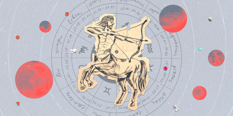Paper cutout of the Sagittarius zodiac on a gray background
