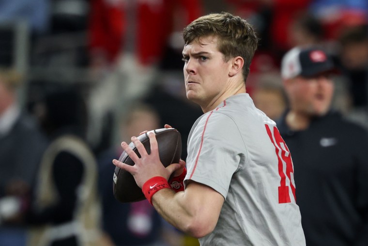 Quarterback Will Howard #18 of the Ohio State Buckeyes warms up before the Cotton Bowl.