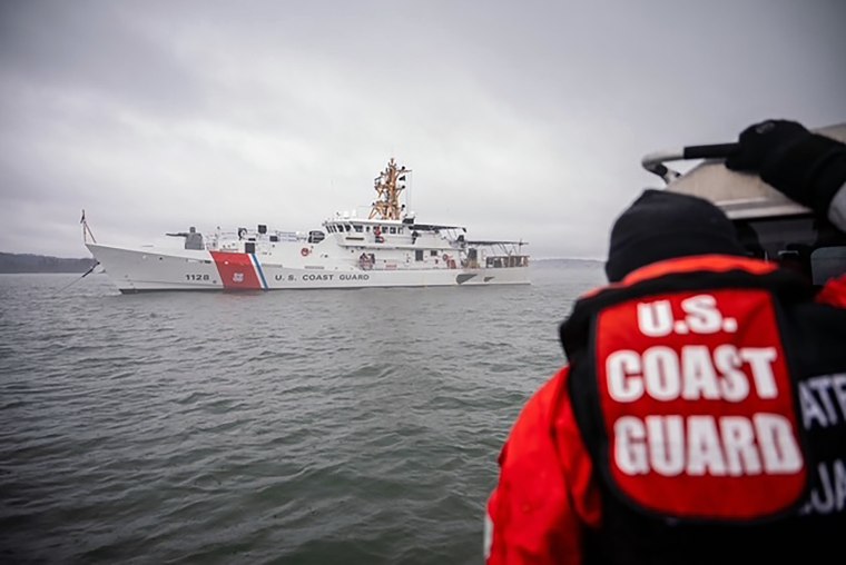 Photos shared with NBC News by U.S. Coast Guard of their response to the Potomac plane crash on Jan. 31.