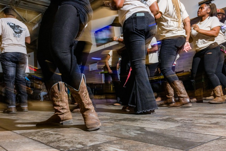 Detail shot of cowboy boots dancing on a dance floors