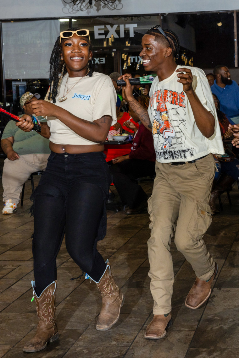 Ja’Mai Richardson, left, and Quinton Dais perform a line dance