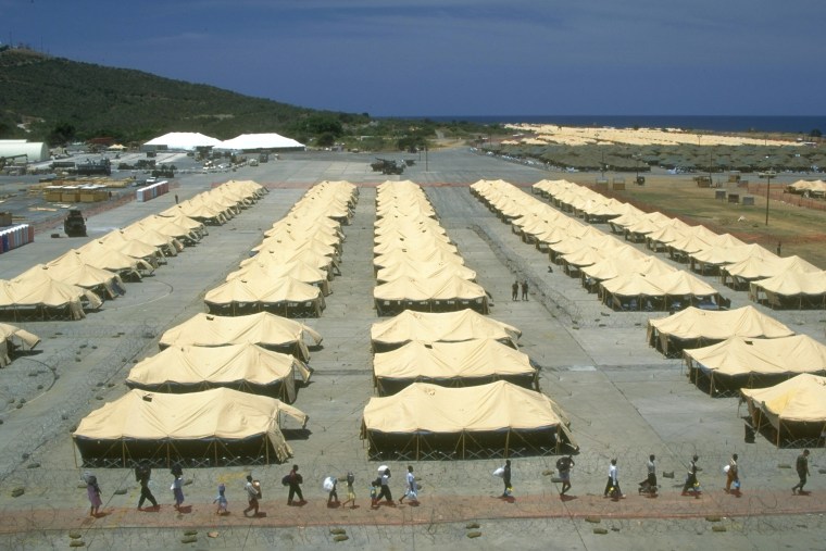 Overview of US-run refugee camp w. rows of tents Haitian refugees