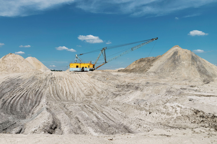 Walking excavator in the titanium ore quarry. Minerals mining in Ukraine