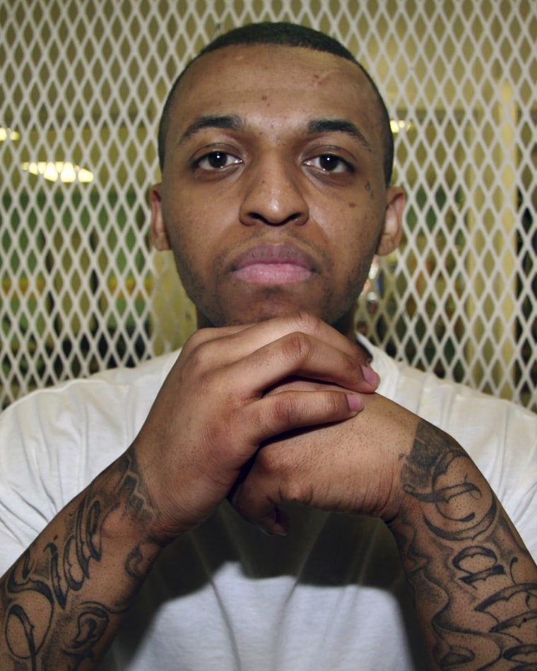 Texas death row inmate Steven Lawayne Nelson poses for a photo in a visiting cage at the Texas Department of Criminal Justice Polunsky Unit outside Livingston, Texas, on Dec. 5, 2012. 