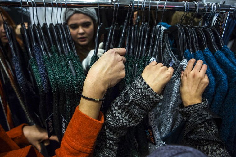 People shop on Thanksgiving Day in New York on Nov. 28, 2013.