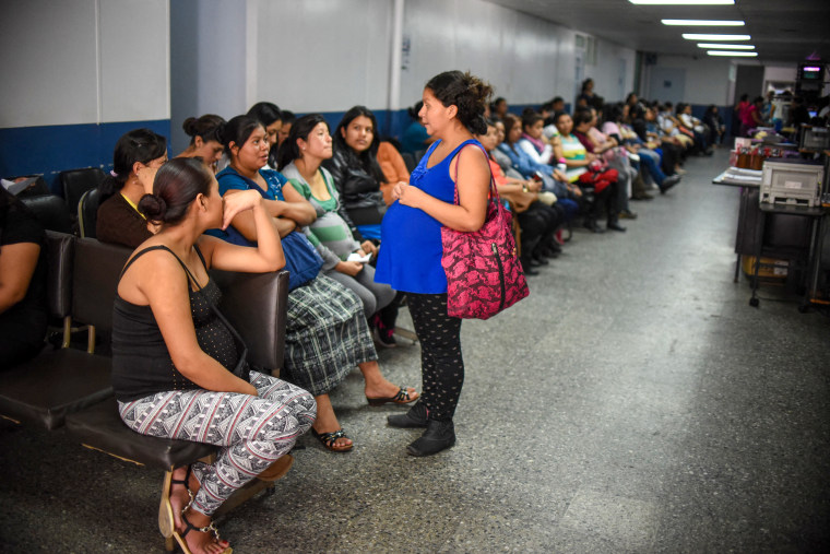 A group of pregnant women wait to be attended.