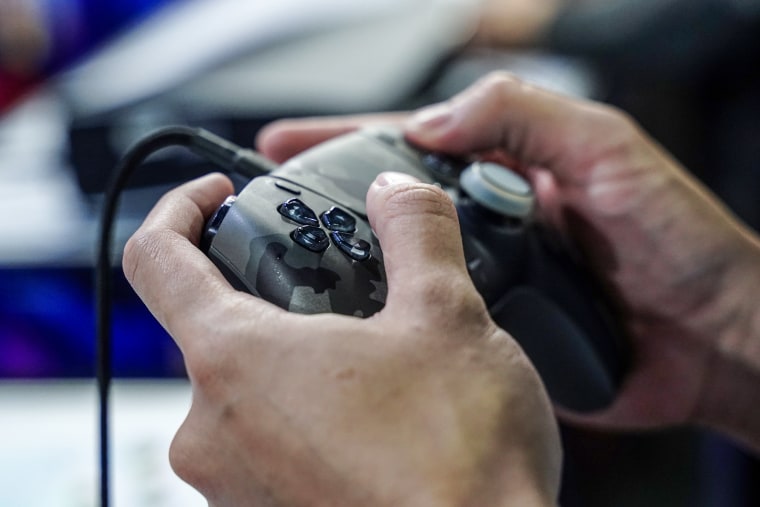 A person plays with the console.