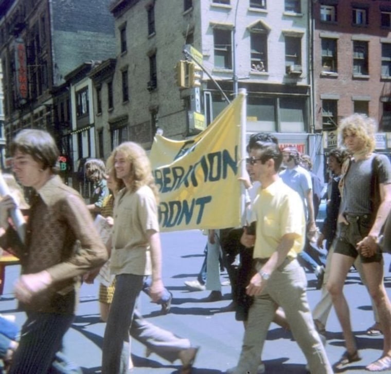 People walk in the NYC Pride March outside