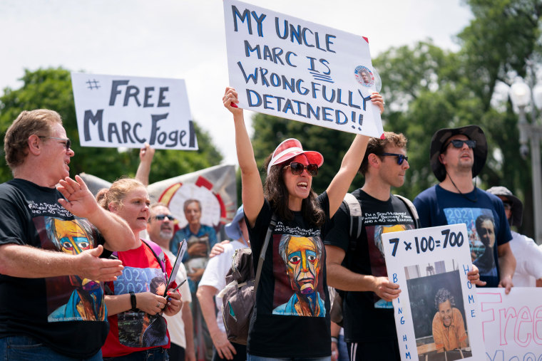 Ellen Keelan, center, and other family members rally outside the White House for the release of Marc Fogel