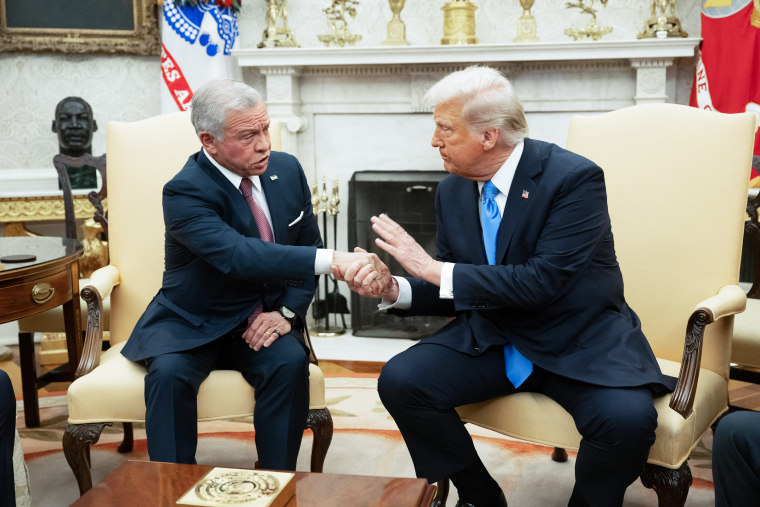 King Abdullah II of Jordan shakes hands with President Trump