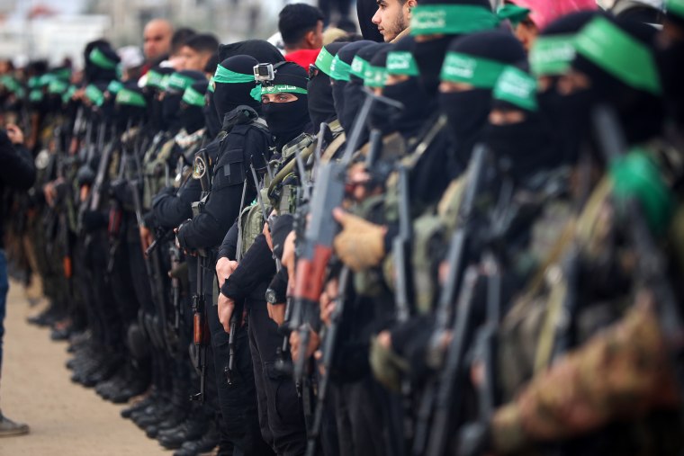 Hamas militants hand over three Israeli hostages on February 8, as part of the fifth exchange under a fragile Gaza ceasefire, with 183 prisoners held by Israel due to be released later in the day. 